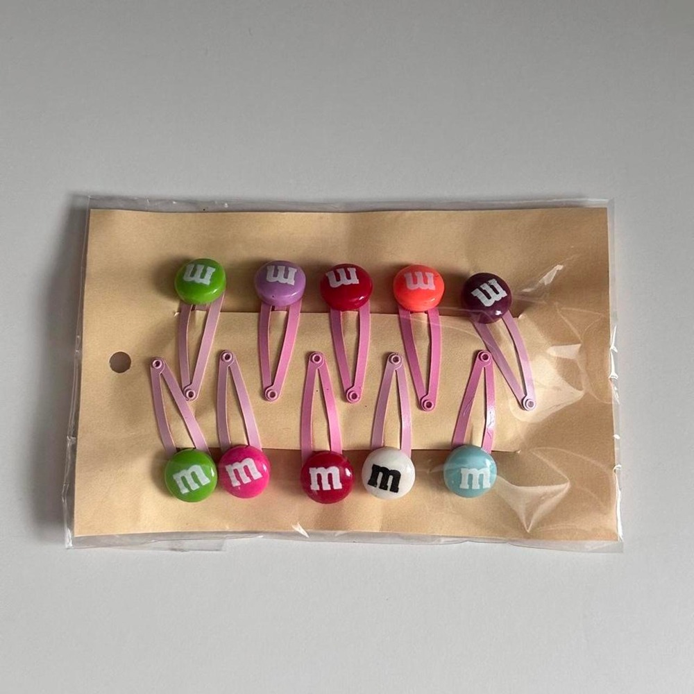 M&M's hair clips with M&M's candies on top